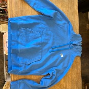 large worn blue nike sweatshirt
